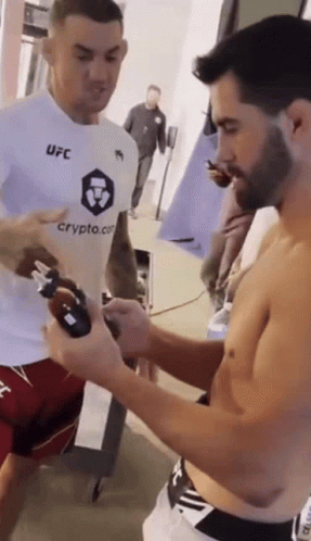 Two Men In Boxing Ring With Guaranteed Pain Sign GIF