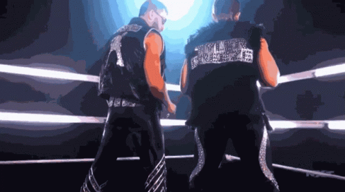 Two Men in Boxing Ring with Smack Down Vest