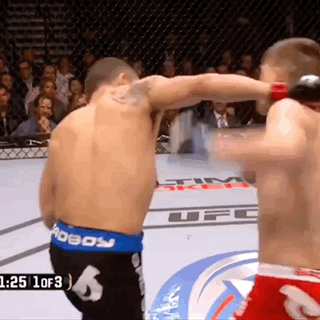 Two Men In Boxing Ring With UFC Logo GIF