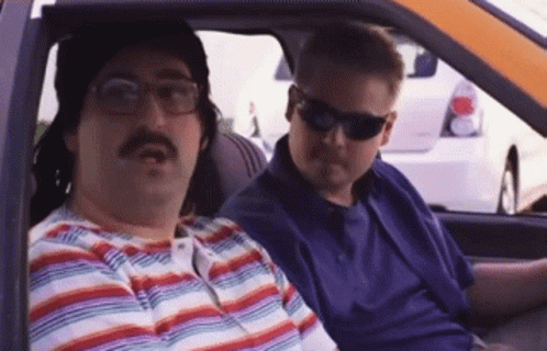 Two Men In Car One With Sunglasses GIF