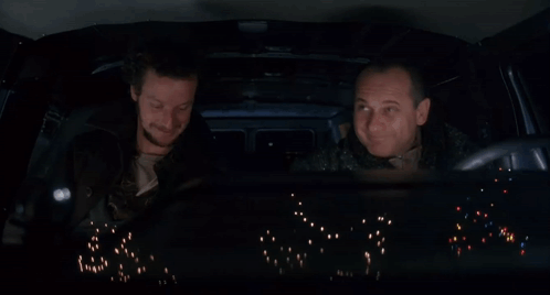Two Men in Car Yellow Crow Bars Up