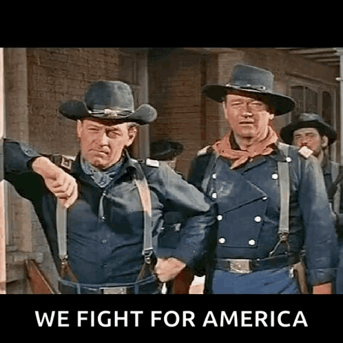 Two Men In Cowboy Hats And Suspenders Pointing GIF