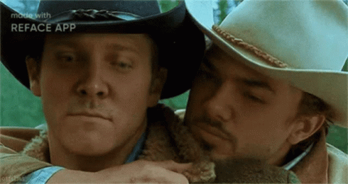 Two Men In Cowboy Hats Hugging GIF