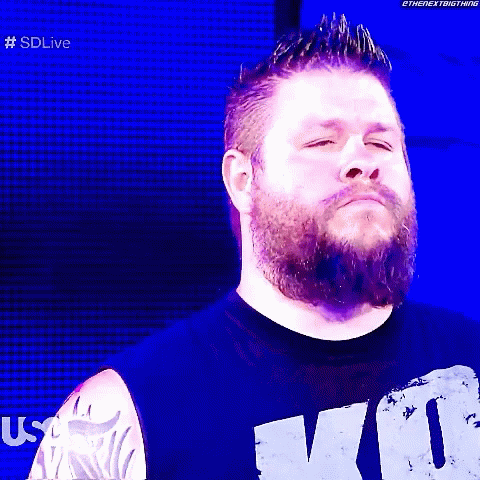 Two Men in Dark Room Tattoo Saying K