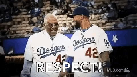 Two Men in Dodgers Jerseys Shaking Hands