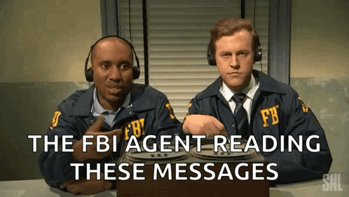 Two Men In Fbi Uniforms Are Reading Messages GIF