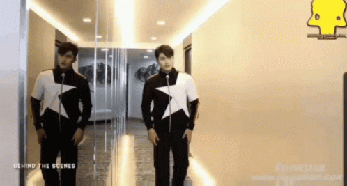 Two Men in Hallway Behind the Scenes