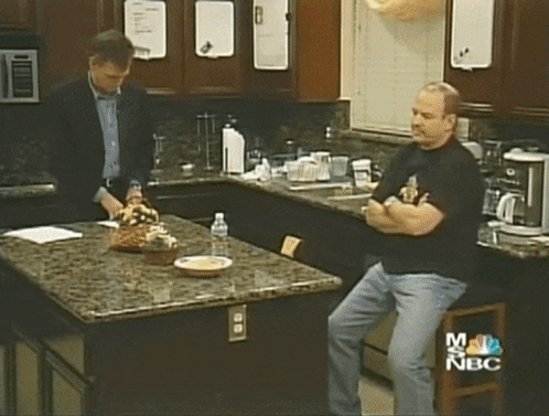 Two Men In Kitchen With NBC Logo GIF