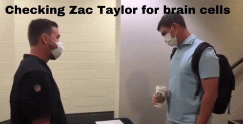 Two Men in Masks Checking Zac Taylor for Brain Cells