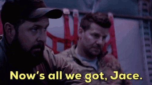 Two Men In Military Uniforms Are Sitting Next To Each Other And Talking . GIF