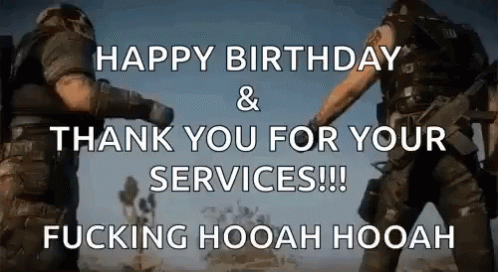 Two Men In Military Uniforms Standing In Desert GIF