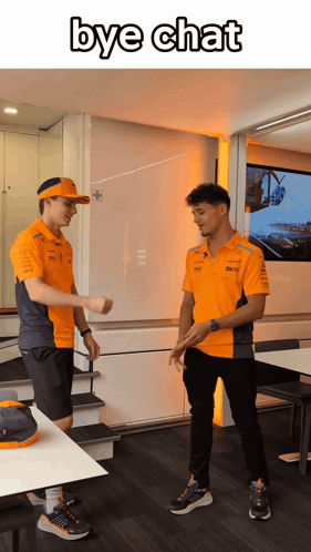 Two Men In Orange Shirts Are Standing Next To Each Other With The Words Bye Chat Written Above Them GIF
