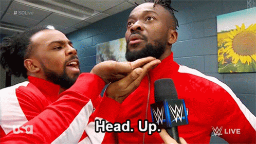 Two Men In Red Jackets Talking GIF
