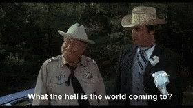 Two Men In Suits And Hats GIF