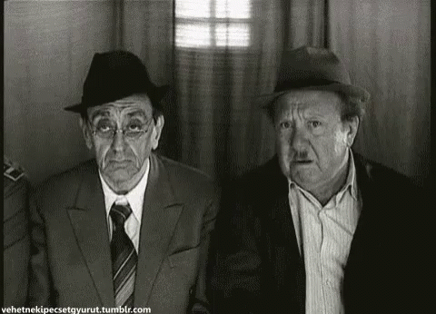 Two Men in Suits and Hats in Black and White Photo