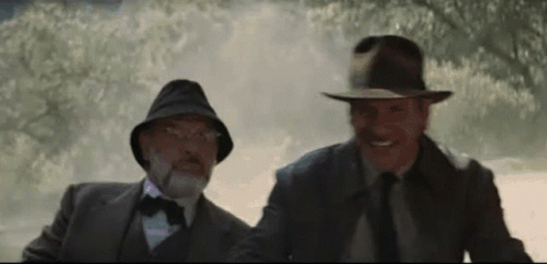 Two Men in Suits and Hats in Foggy Forest