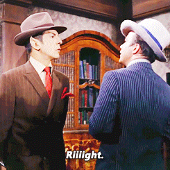 Two Men in Suits and Hats Saying Riiight