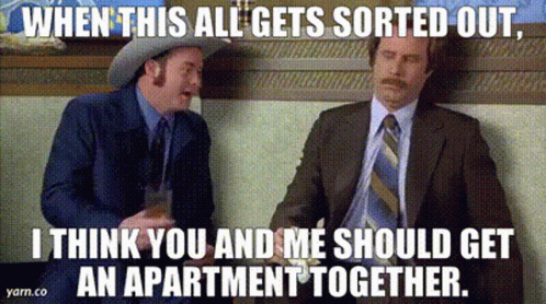 Two Men In Suits And Ties Are Sitting Next To Each Other And Talking . One Of The Men Is Wearing A Cowboy Hat . GIF