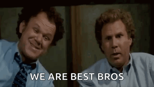 Two Men In Suits Laughing Side By Side GIF
