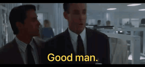 Two Men In Suits And Ties Are Standing Next To Each Other And One Of Them Says Good Man GIF