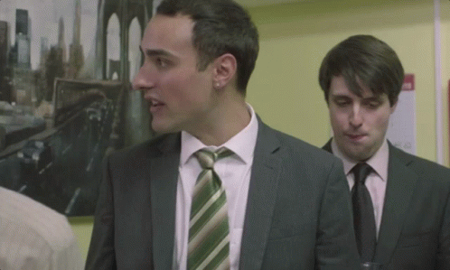 Two Men In Suits And Ties GIF