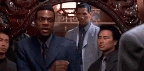 Two Men In Suits And Ties Talking GIF