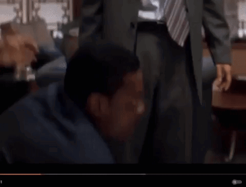 Two Men In Suits And Ties Talking GIF