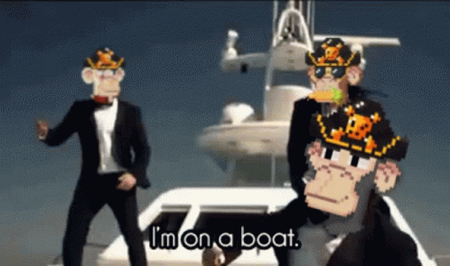 Two Men In Suits Are Dancing In Front Of A Boat With The Words I 'M On A Boat On The Bottom GIF