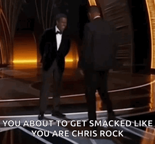 Two Men In Suits Are Dancing On A Stage And One Of Them Says You About To Get Smacked Like You Are Chris Rock . GIF