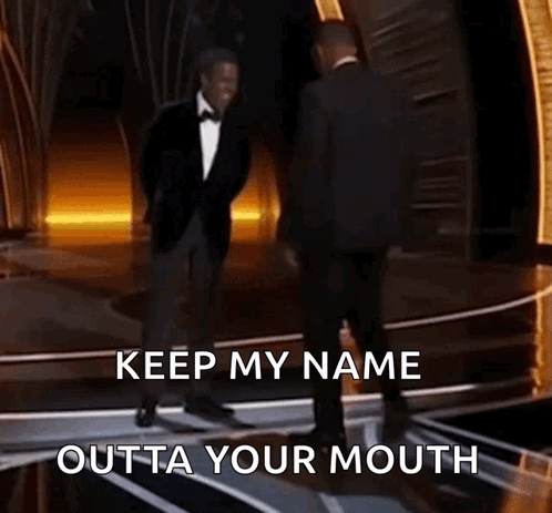 Two Men In Suits Are Dancing On A Stage With The Words Keep My Name Outta Your Mouth Written Below Them GIF