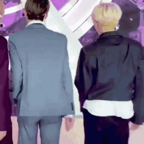 Two Men In Suits Are Standing Next To Each Other GIF