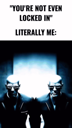 Two Men In Suits Are Standing Next To Each Other With The Words " You 'Re Not Even Locked In " Literally Me On The Botto GIF