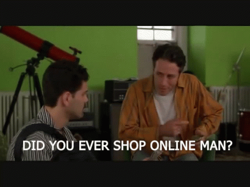 Two Men In Suits Holding Coffee On City Street GIF