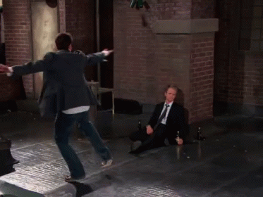 Two Men in Suits Jumping and Sitting