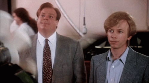 Two Men In Suits Making Funny Faces GIF