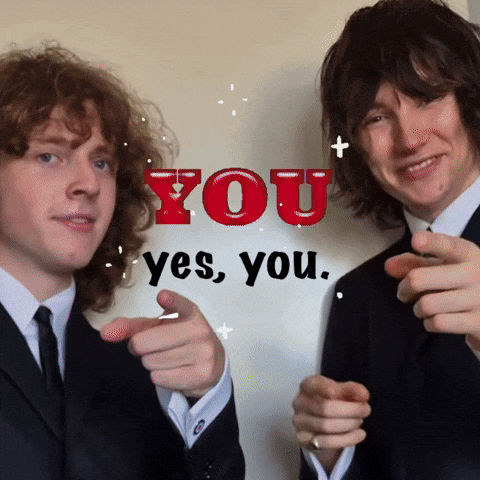 two men in suits pointing at the camera with the words you yes you