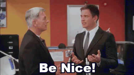 Two Men in Suits Saying Be Nice