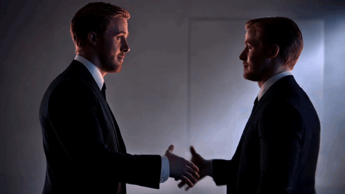 Two Men in Suits Shaking Hands
