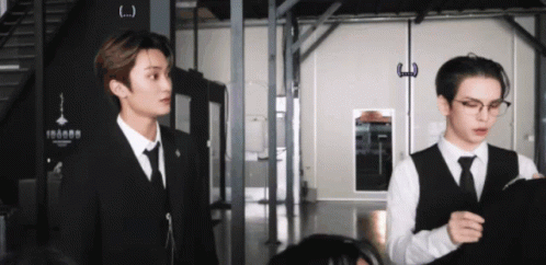 Two Men in Suits Standing