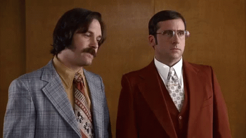 Two Men In Suits Standing Next To Each Other With The Words " I Love Lamp " In Yellow Letters GIF