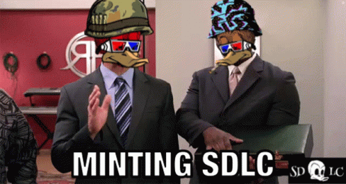 Two Men In Suits Standing Next To Each Other With The Words Minting Sdlc Written On The Bottom GIF