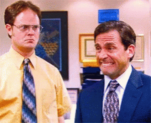 Two Men in Suits Standing Together