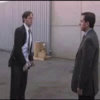 Two Men In Suits Standing Together GIF