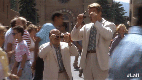 Two Men in Suits Taking Photo of Crowd #laff