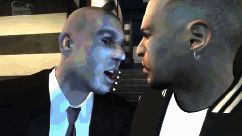 Two Men In Suits Talking GIF