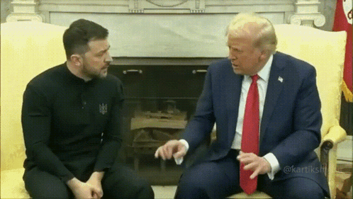 Two Men in Suits Talking on Couch