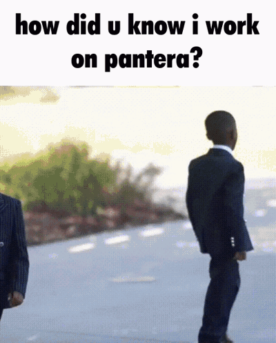 Two Men in Suits With Pantera Quote