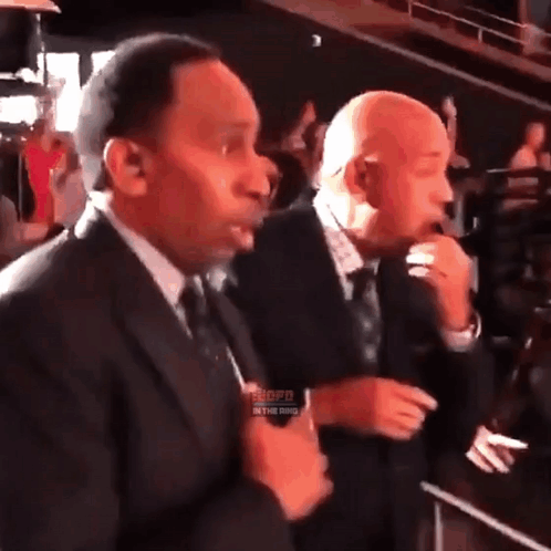 Two Men in Suits With Word Shopd