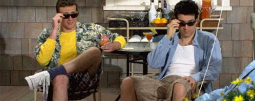 Two Men in Sunglasses at Table