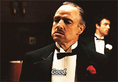 Two Men in Tuxedos Saying Good